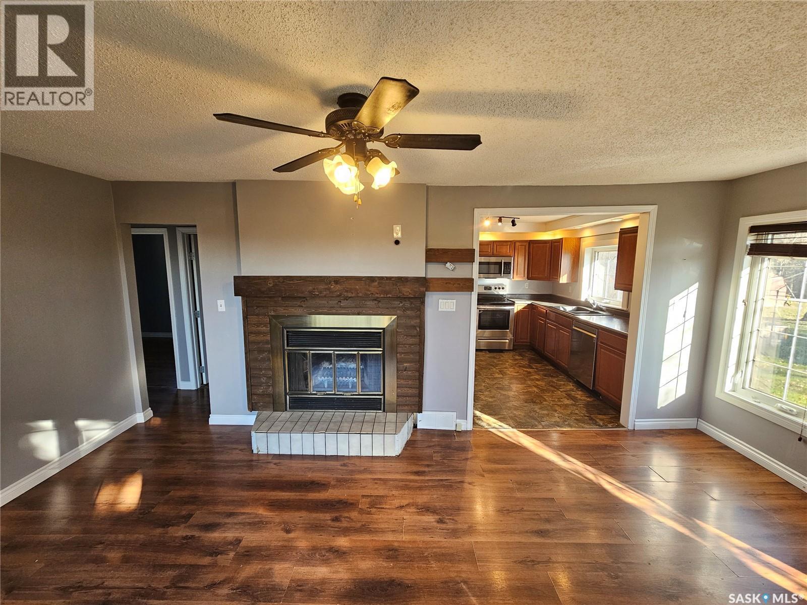 503 Souris Avenue E, Carlyle, SK - Indoor Photo Showing Living Room With Fireplace