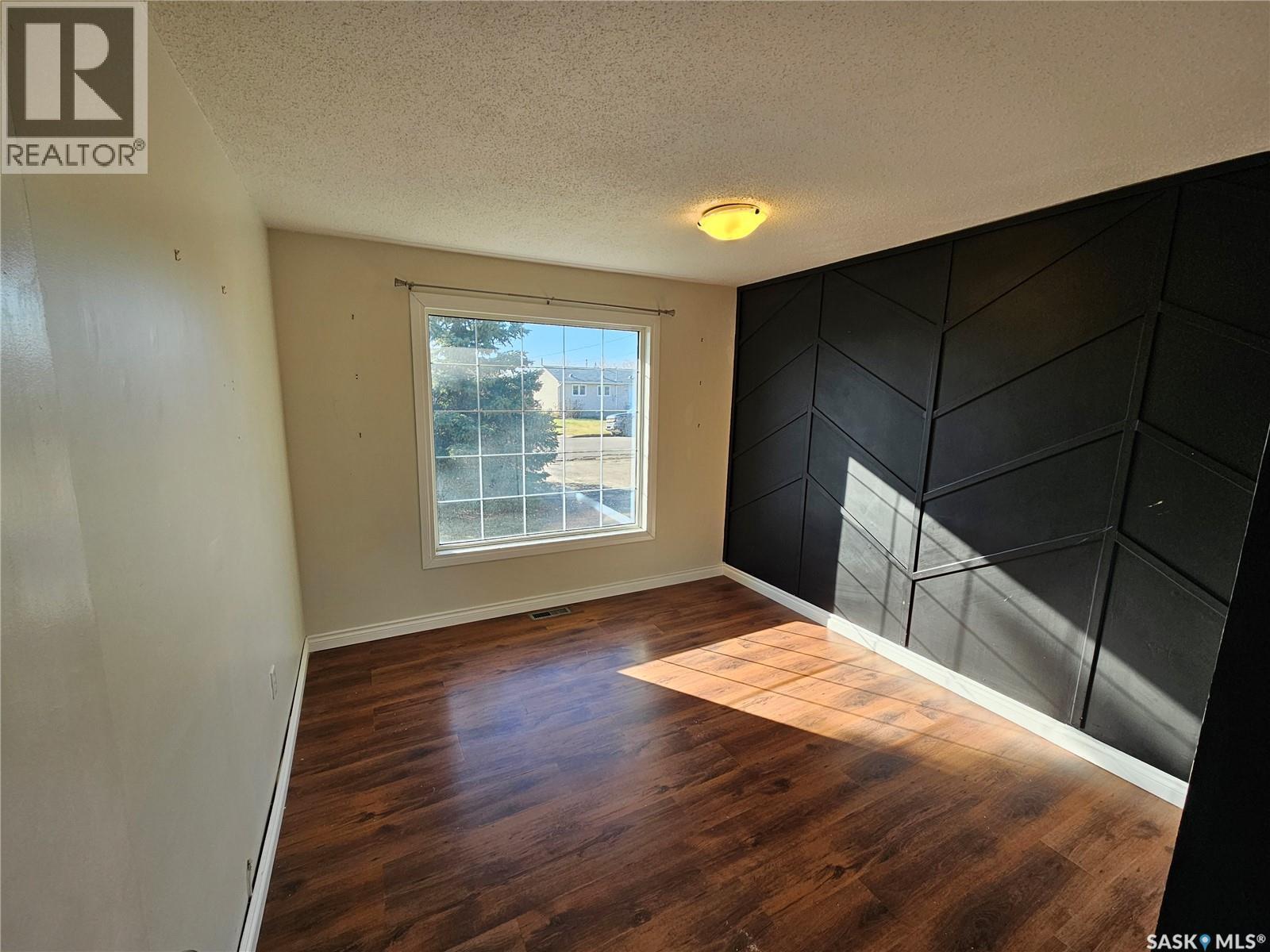 503 Souris Avenue E, Carlyle, SK - Indoor Photo Showing Other Room With Fireplace