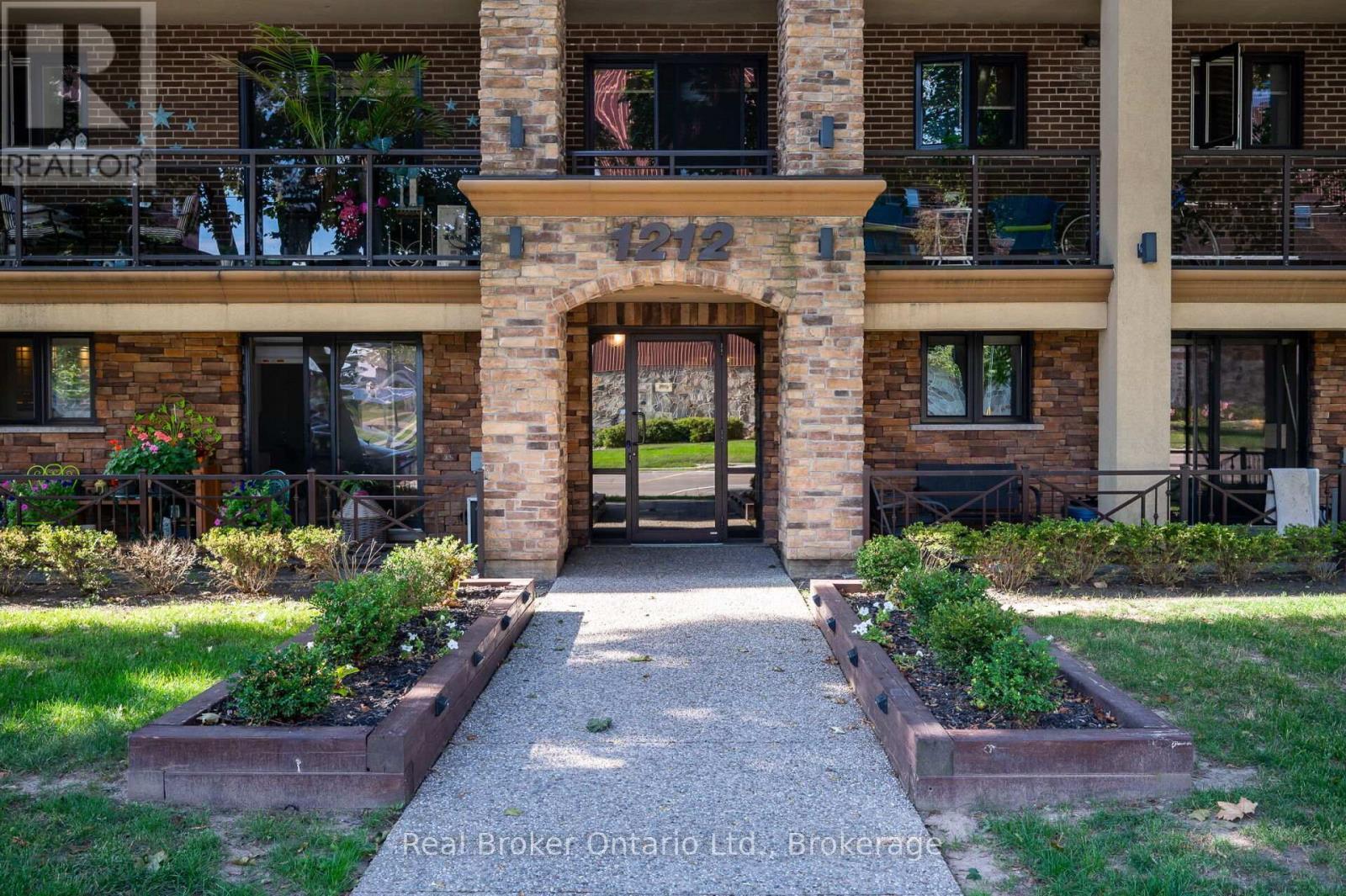 303 - 1212 Fennell Avenue E, Hamilton (Huntington), ON - Outdoor With Fireplace