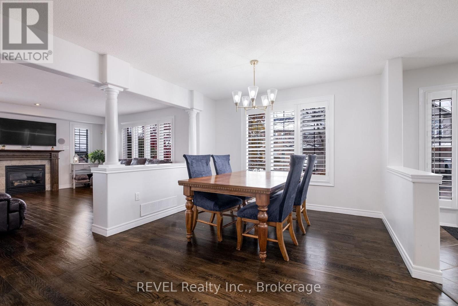 29 Springbreeze Heights, Hamilton (Stoney Creek), ON - Indoor Photo Showing Dining Room With Fireplace
