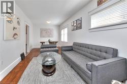 Living area featuring wood finished floors and baseboards -