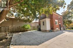 View of home's exterior featuring a balcony and a patio area -
