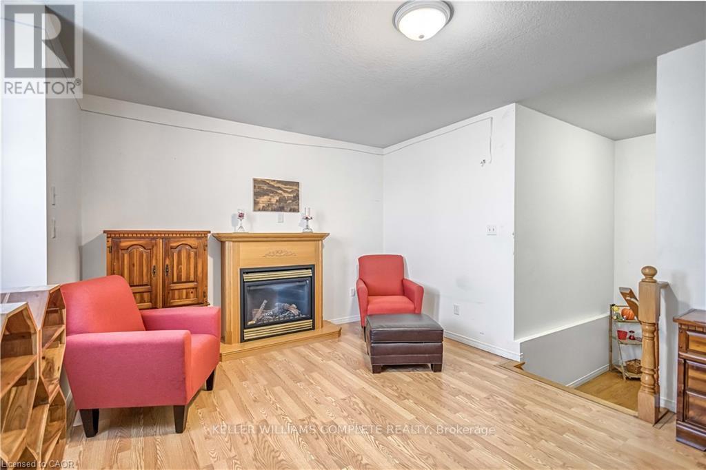 16 Jessica Street, Hamilton, ON - Indoor Photo Showing Other Room With Fireplace