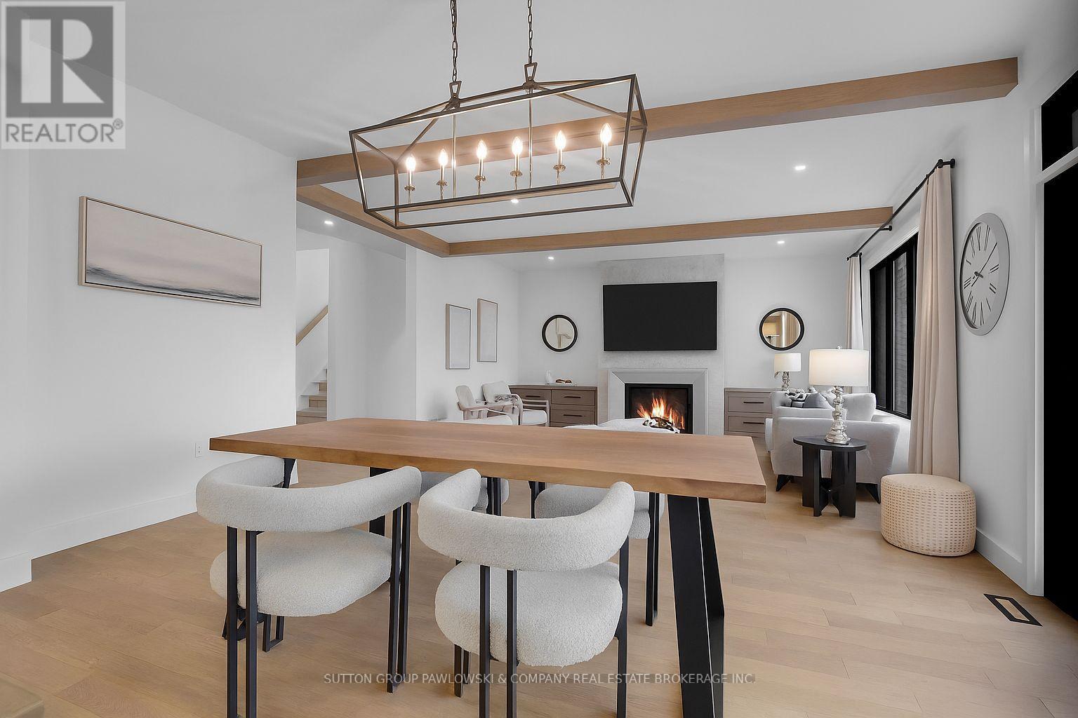 Photos are of model & show upgrades not included. - Lot #16 - 190 Timberwalk Trail, Middlesex Centre (Ilderton), ON - Indoor Photo Showing Dining Room With Fireplace