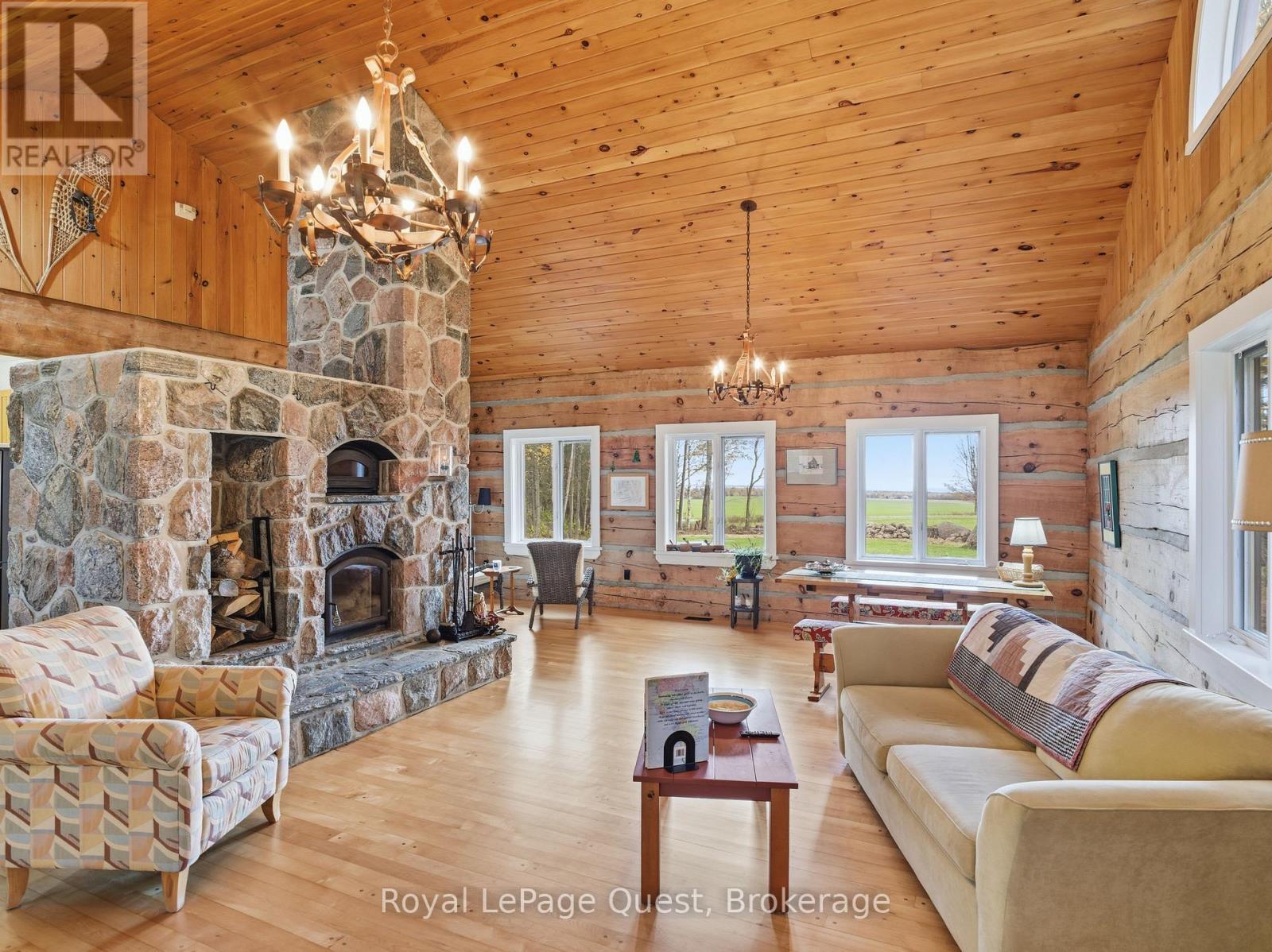 160 14 Concession W, Tiny, ON - Indoor Photo Showing Living Room With Fireplace
