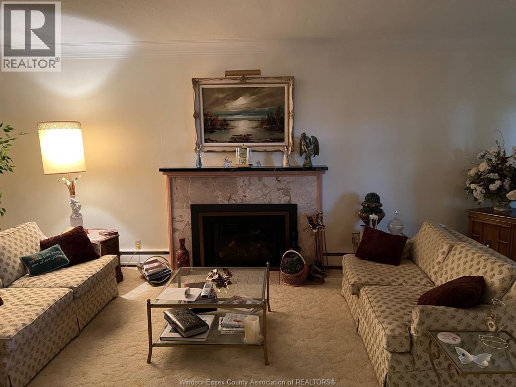 4470 Riverside Drive East, Windsor, ON - Indoor Photo Showing Living Room With Fireplace