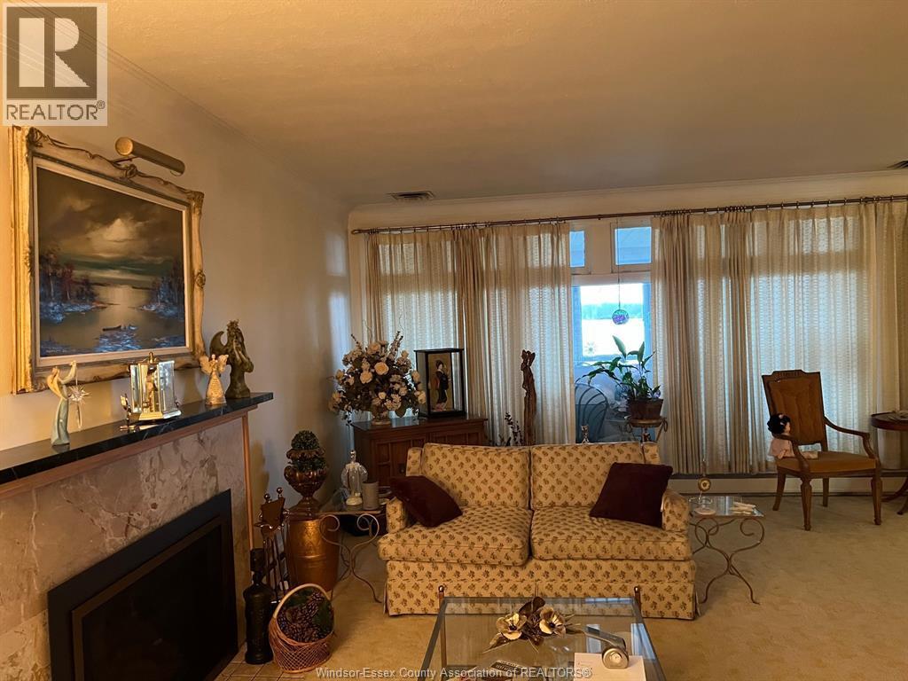 4470 Riverside Drive East, Windsor, ON - Indoor Photo Showing Living Room With Fireplace