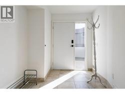 Main floor entrance door located next to double car garage. -