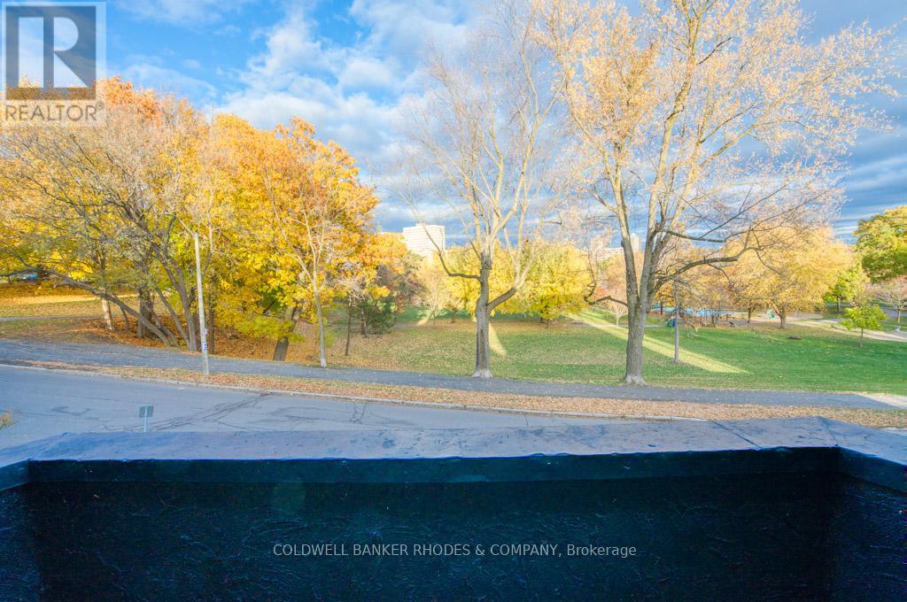 front balcony overlooks Strathcona Park - #1 On 2Nd Floor - 8 1/2 Range Road, Ottawa, ON