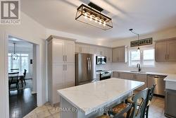 Open Concept Kitchen with Stainless Appliances -