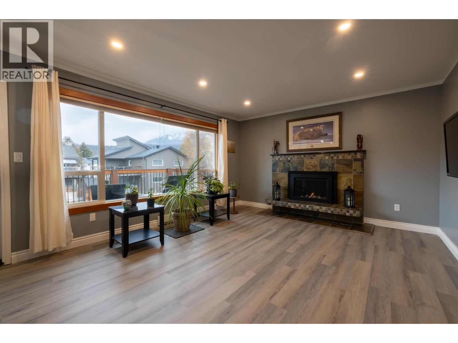 Main living room - 36 Mt Klauer Street, Fernie, BC - Indoor Photo Showing Living Room With Fireplace