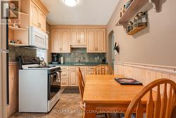 Eat-in kitchen with oak cabinets -