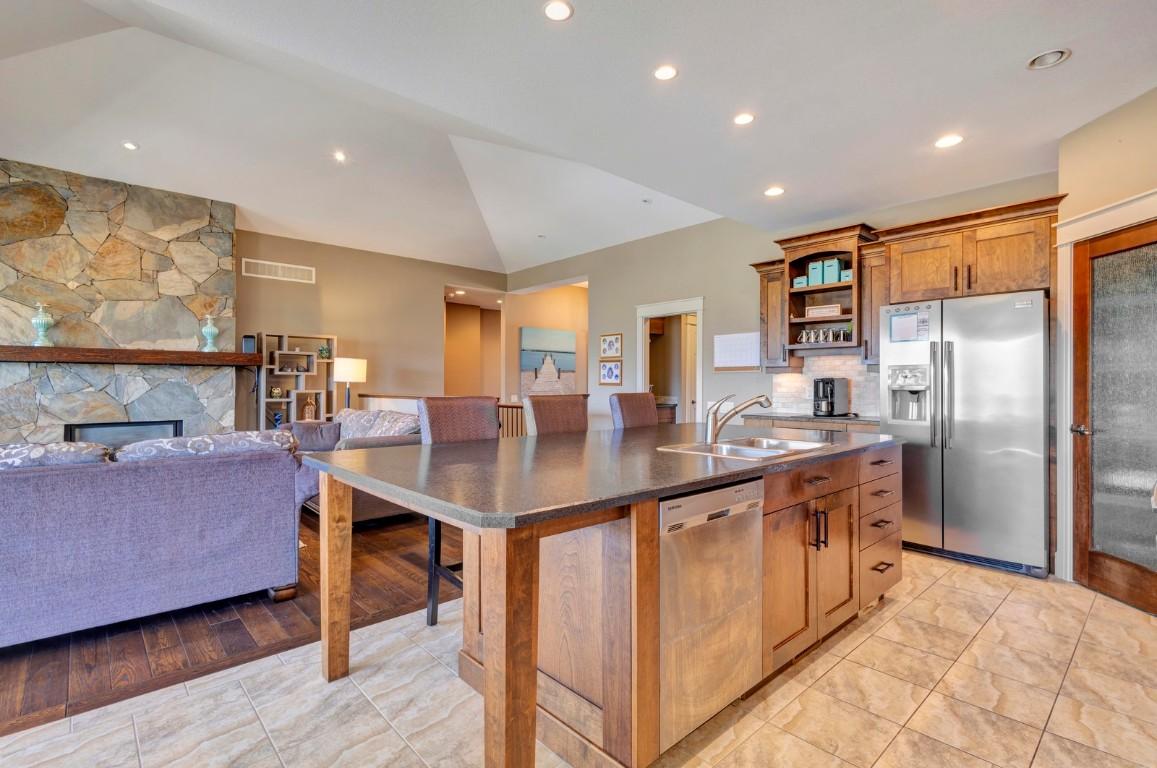 1205 Loseth Drive, Kelowna, BC - Indoor Photo Showing Kitchen With Fireplace With Double Sink
