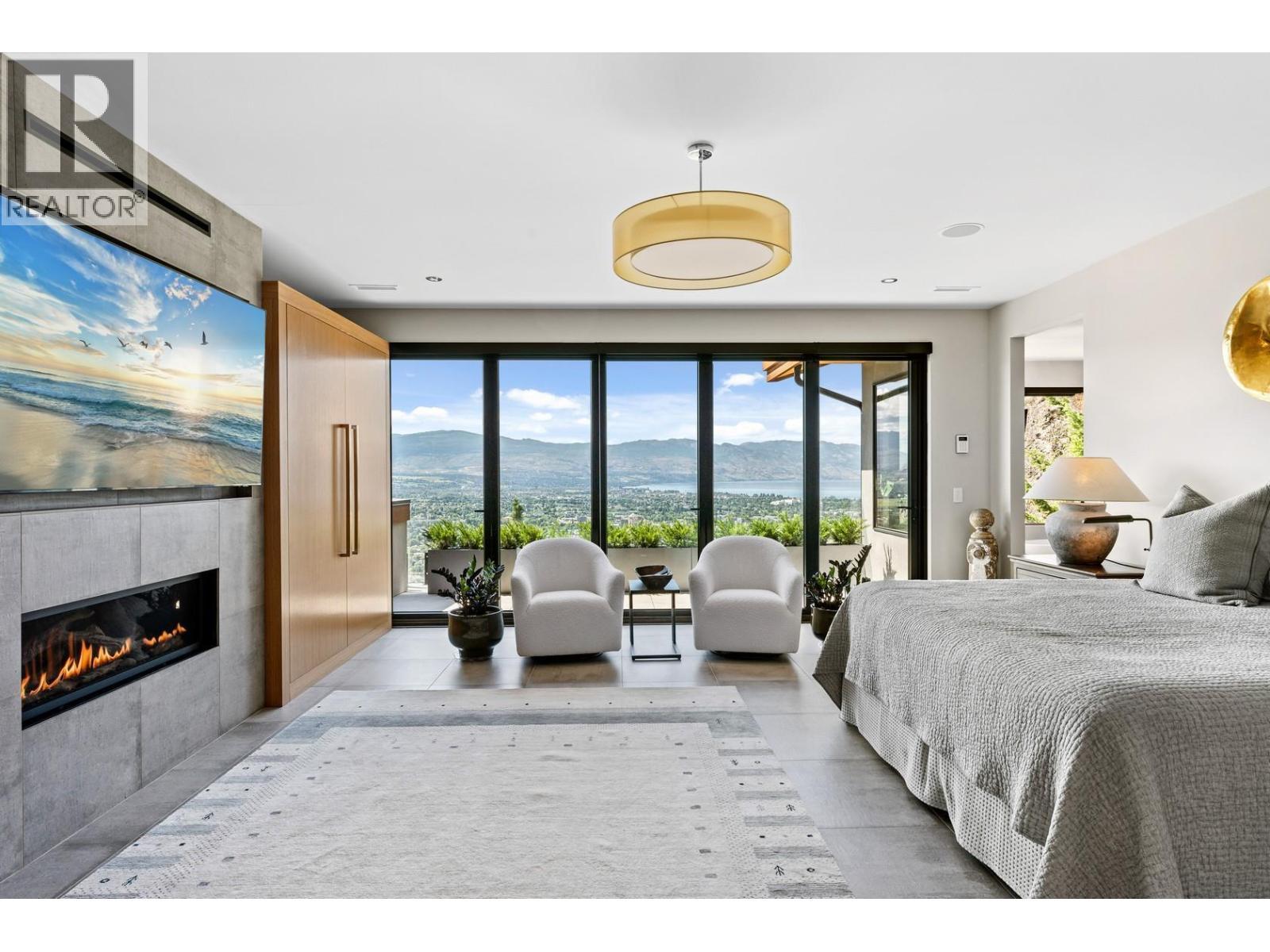 733 Forestridge Lane, Kelowna, BC - Indoor Photo Showing Bedroom With Fireplace