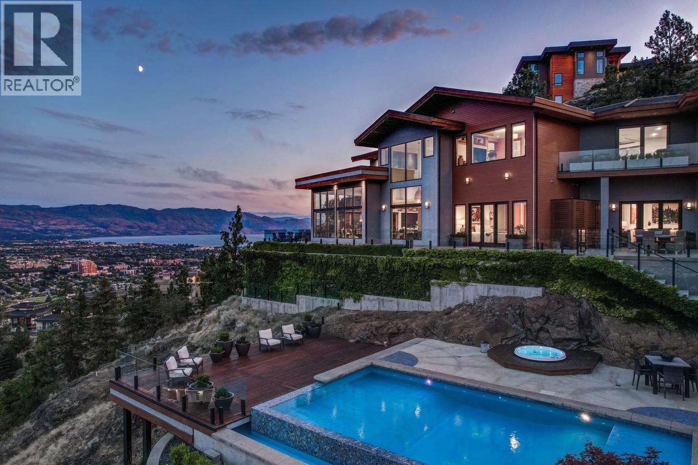 Private 2.6 acre setting for the magnificent home perched on granite cliff side setting - 733 Forestridge Lane, Kelowna, BC - Outdoor With In Ground Pool With Balcony