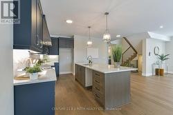 Island with additional storage and breakfast bar -