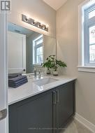 Main floor powder room by foyer -
