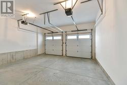 Insulated garage easily accommodates 2 vehicles -