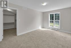 PRIMARY BEDROOM WITH WALK-IN CLOSET -