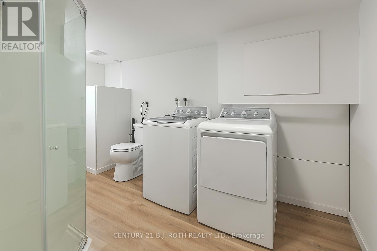 Photo has been virtually staged to add cover - 201 Point Street, Clearview, ON - Indoor Photo Showing Laundry Room