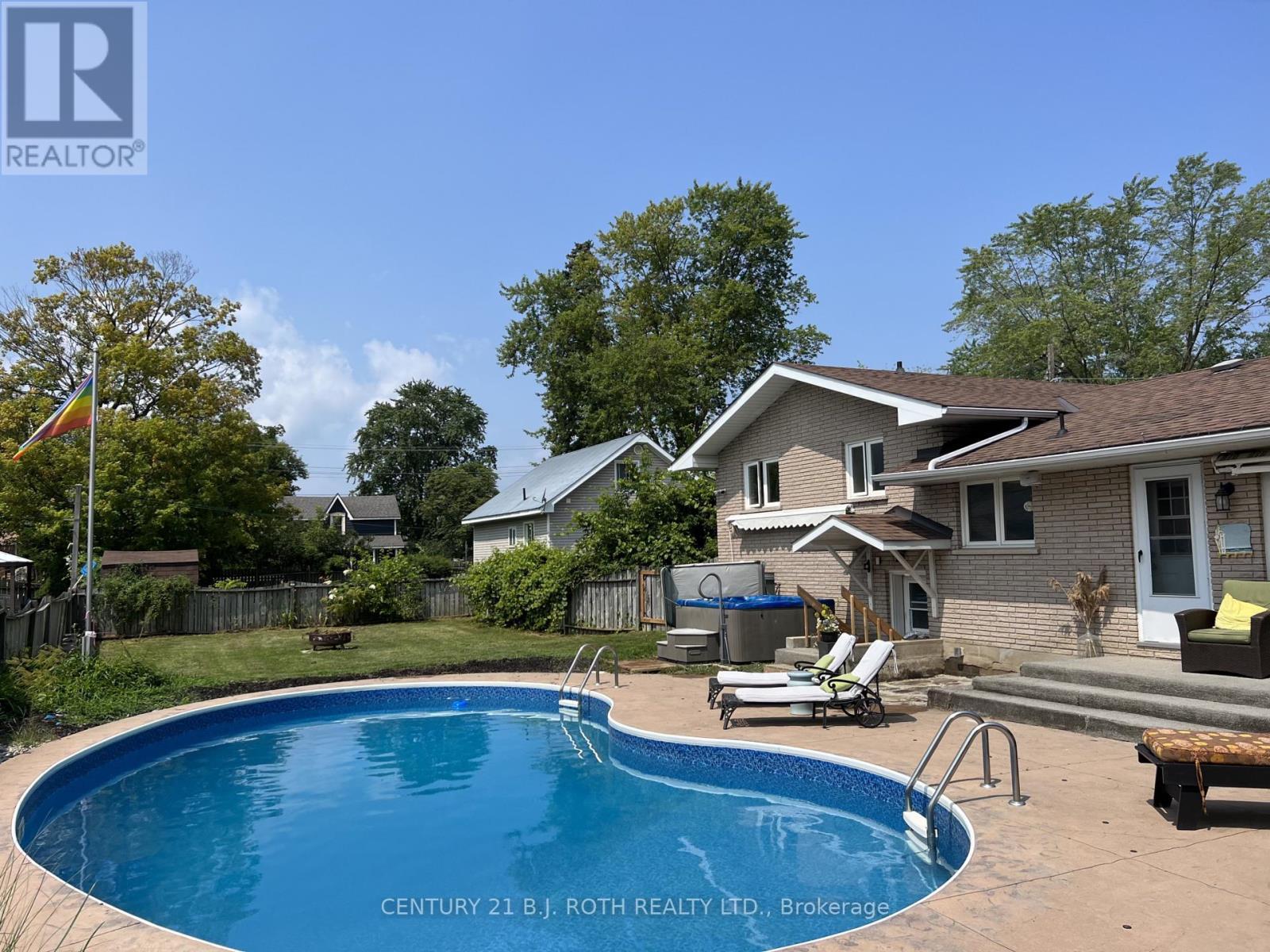 Summer view of backyard provided by seller - 201 Point Street, Clearview, ON - Outdoor With In Ground Pool With Deck Patio Veranda With Backyard