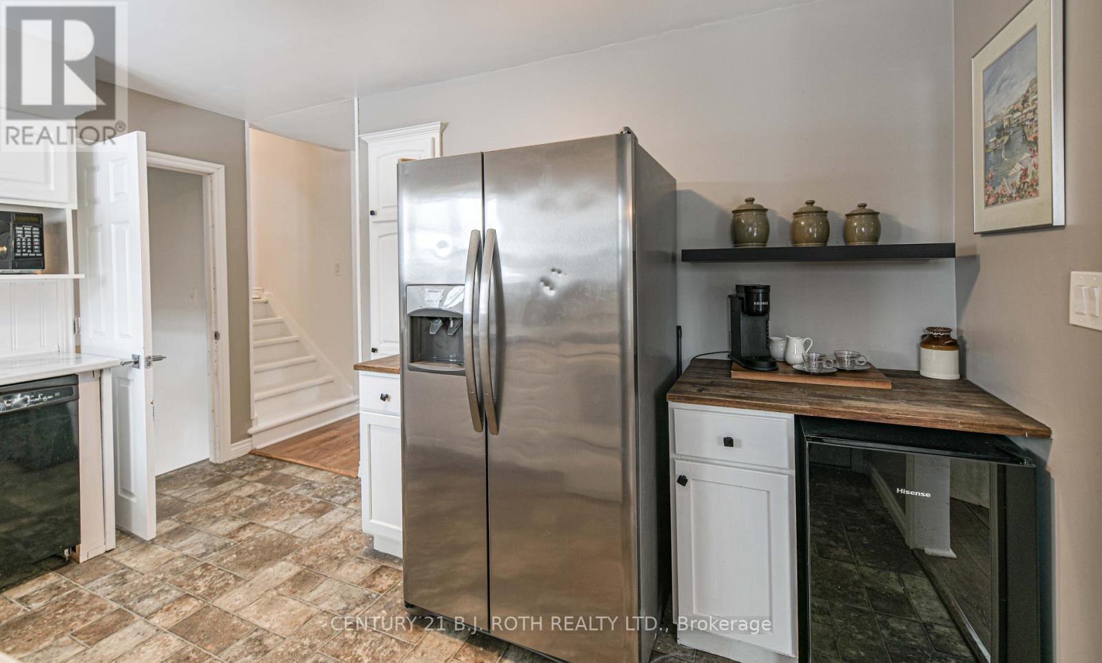 Kitchen with stairs to upper and lower level - 201 Point Street, Clearview, ON - Indoor