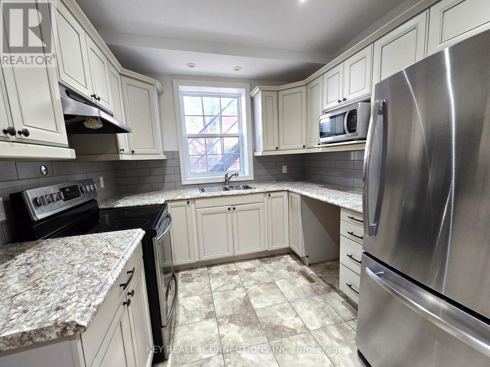 Main floor kitchen - 208 King Street E, Kingston, ON - Indoor Photo Showing Kitchen With Stainless Steel Kitchen With Double Sink