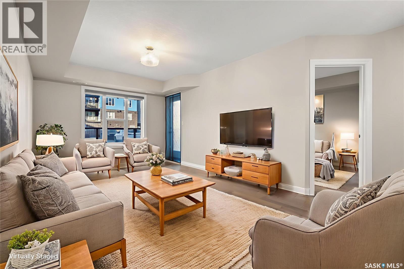 103 5303 Universal Crescent, Regina, SK - Indoor Photo Showing Living Room