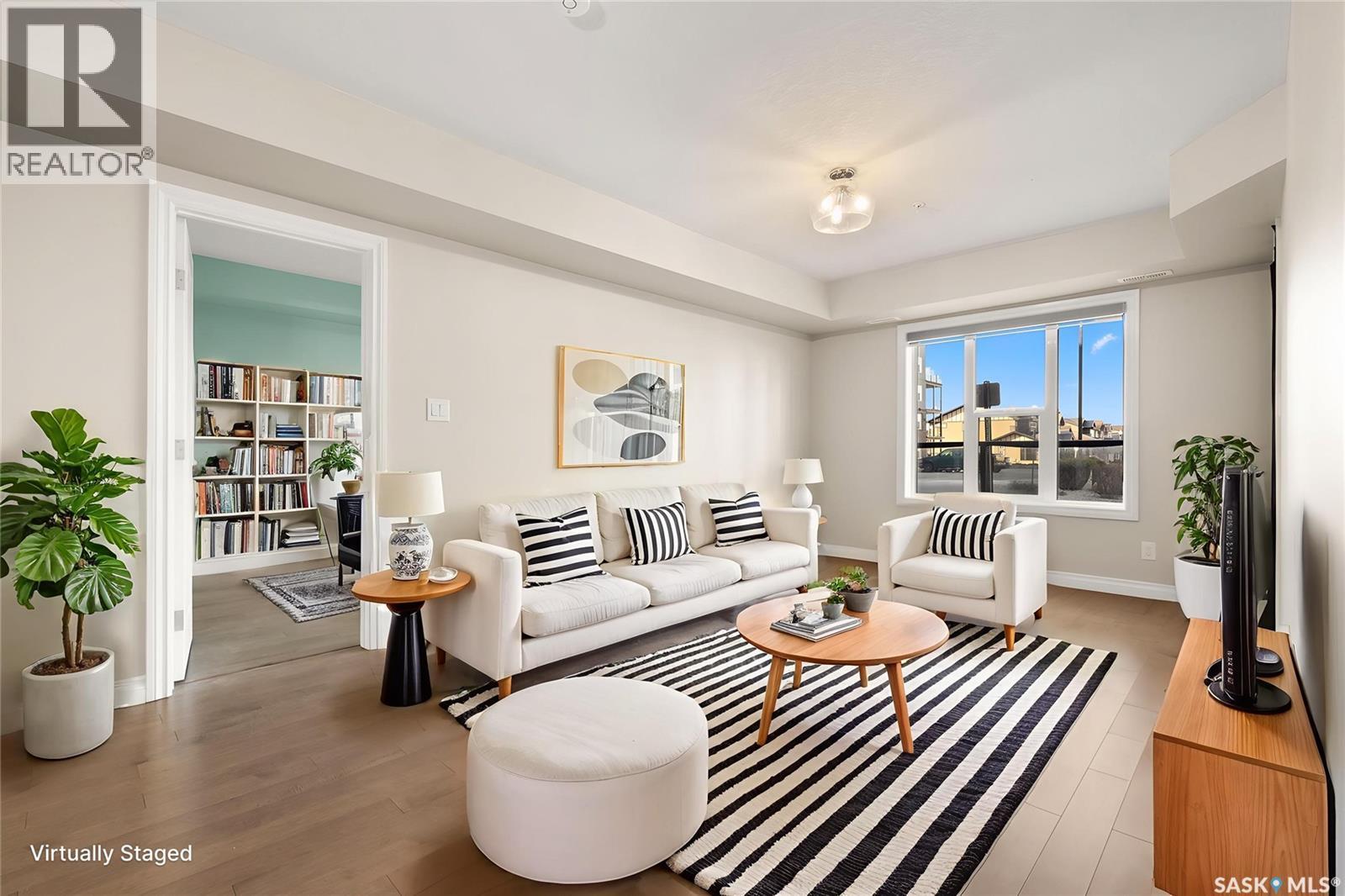 103 5303 Universal Crescent, Regina, SK - Indoor Photo Showing Living Room