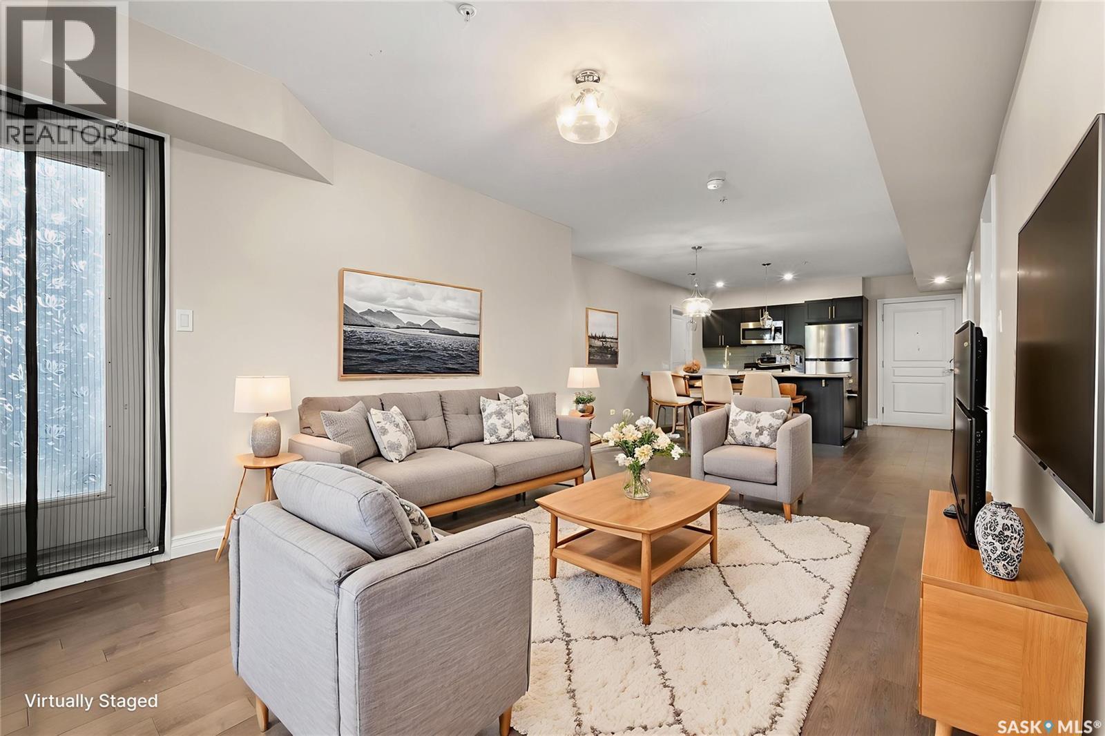 103 5303 Universal Crescent, Regina, SK - Indoor Photo Showing Living Room