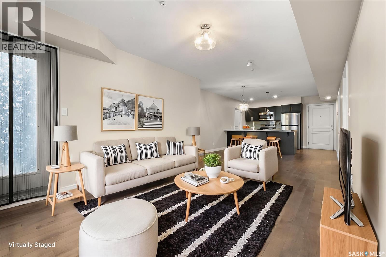 103 5303 Universal Crescent, Regina, SK - Indoor Photo Showing Living Room