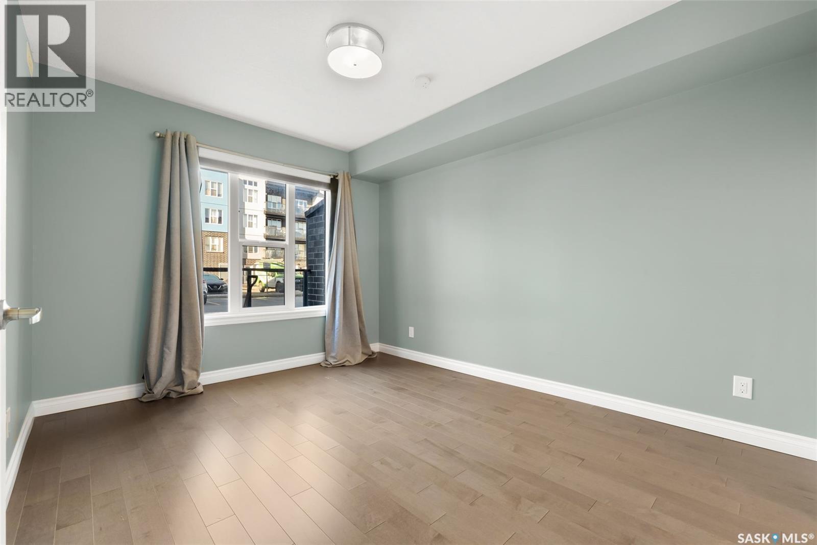 103 5303 Universal Crescent, Regina, SK - Indoor Photo Showing Other Room