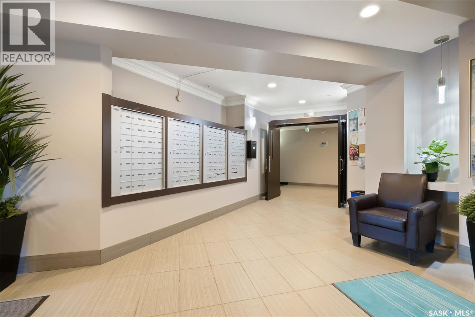 103 5303 Universal Crescent, Regina, SK - Indoor Photo Showing Other Room