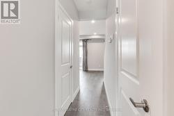 Hall w/2 pc bath on left and storage on right -