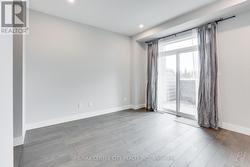 Main level family room w/walkout to balcony -