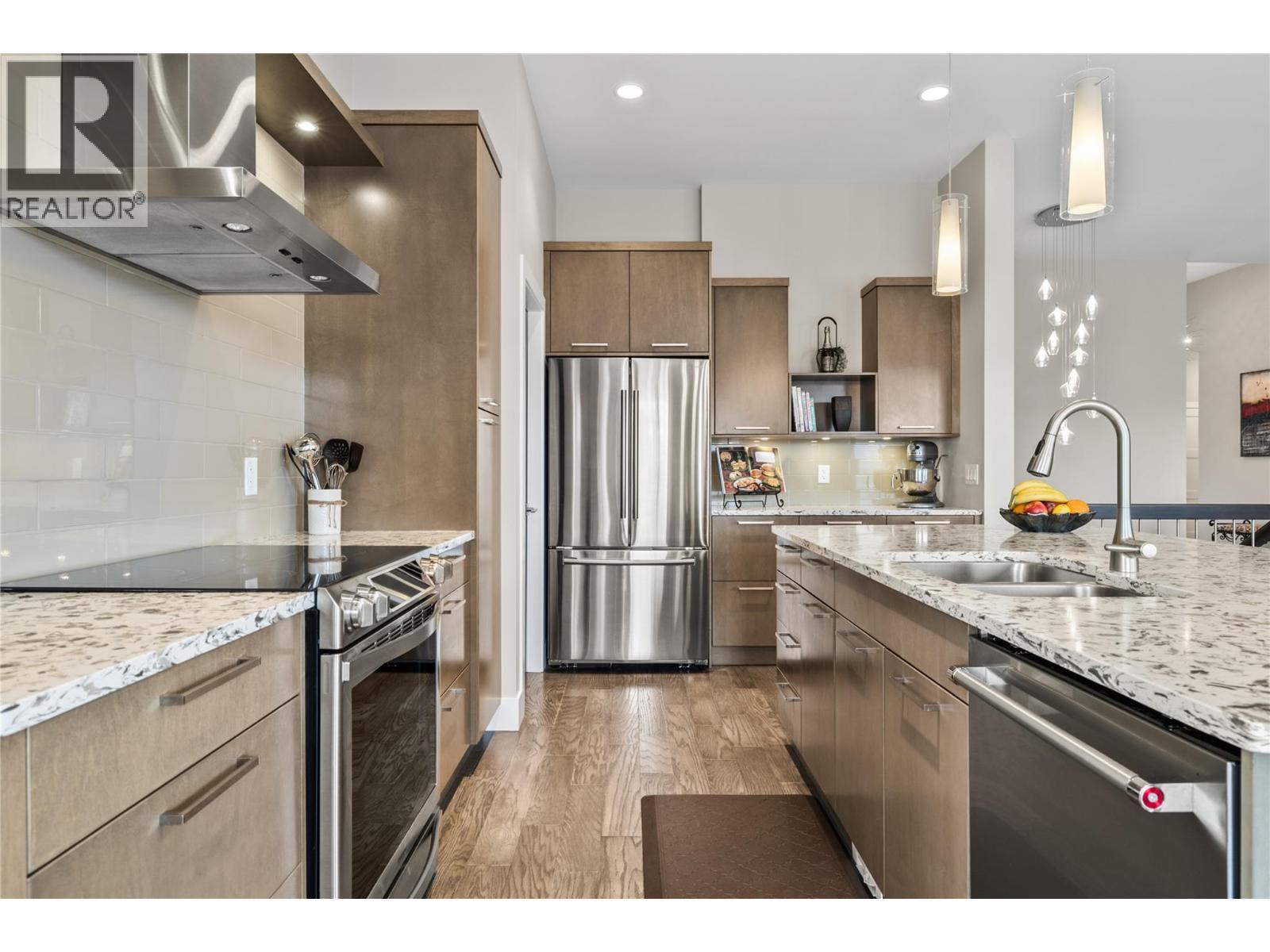 Stainless steel appliances. - 1376 Mine Hill Drive, Kelowna, BC - Indoor Photo Showing Kitchen With Stainless Steel Kitchen With Double Sink With Upgraded Kitchen