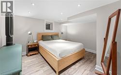 Bedroom featuring recessed lighting and light wood-style flooring -