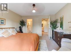 Primary Bedroom, with new lighting and sliding doors to private patio. -