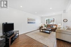 Spacious Living Room with Laminate Flooring -