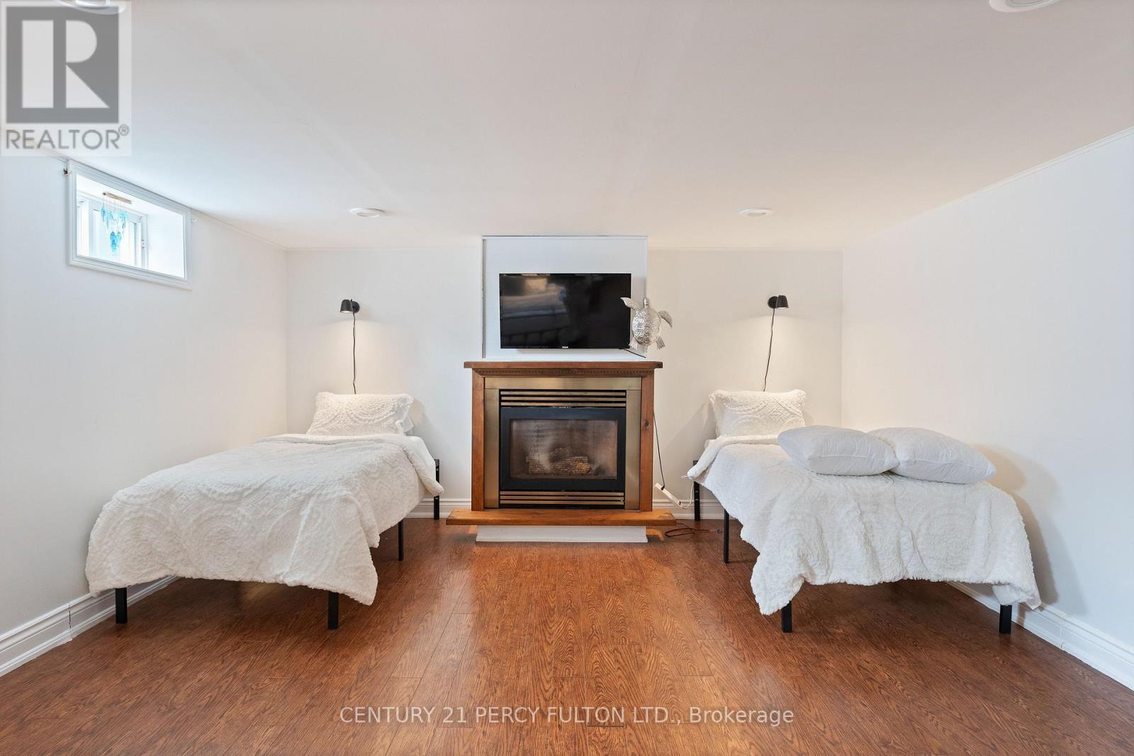 5659 Gilmore Road, Clarington, ON - Indoor Photo Showing Bedroom With Fireplace