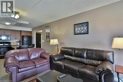 Living area featuring a textured ceiling -
