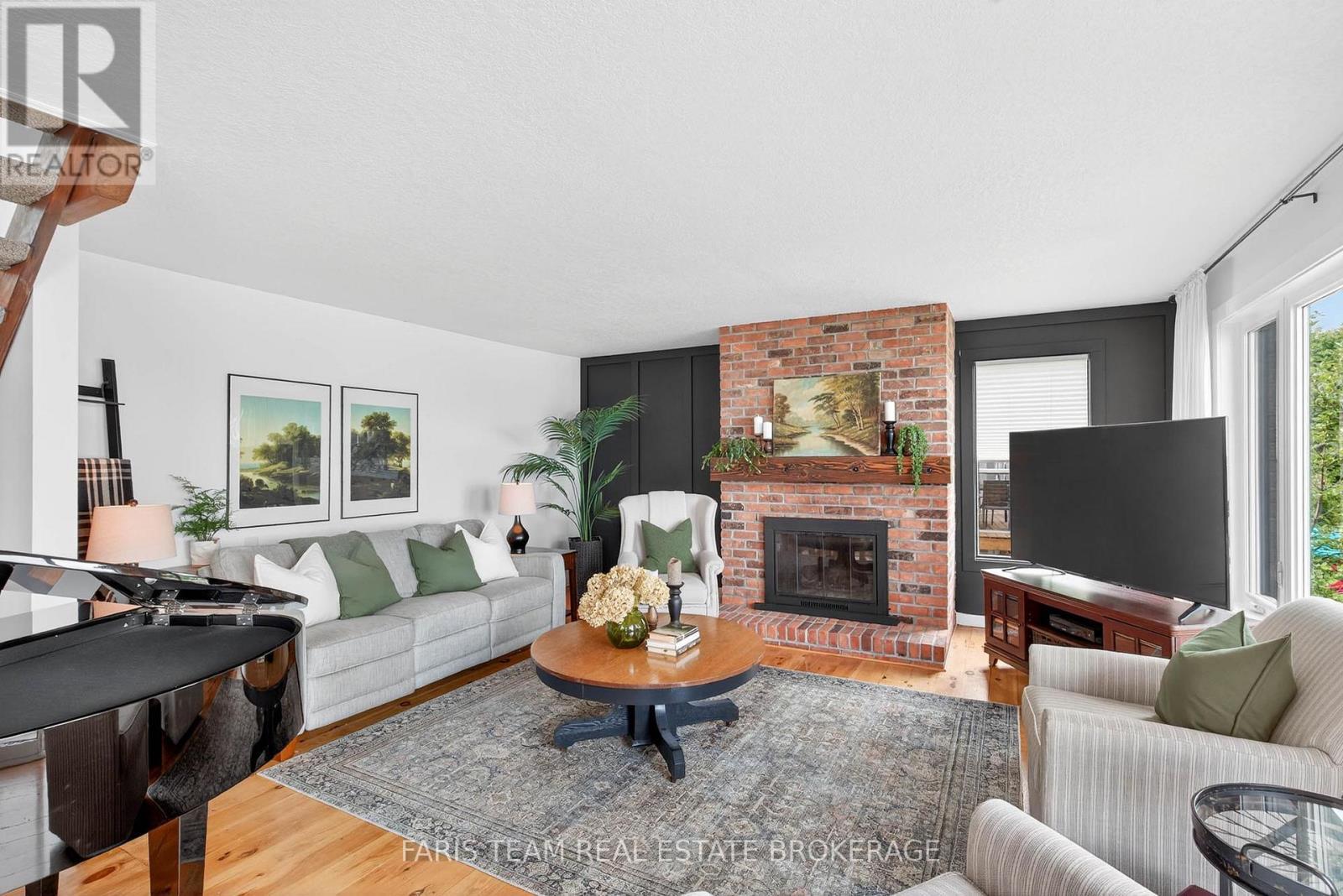 238 Robins Point Road, Tay, ON - Indoor Photo Showing Living Room With Fireplace