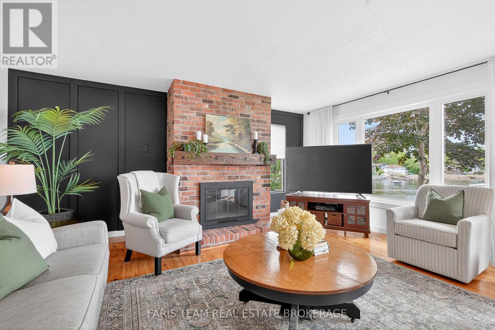238 Robins Point Road, Tay, ON - Indoor Photo Showing Living Room With Fireplace