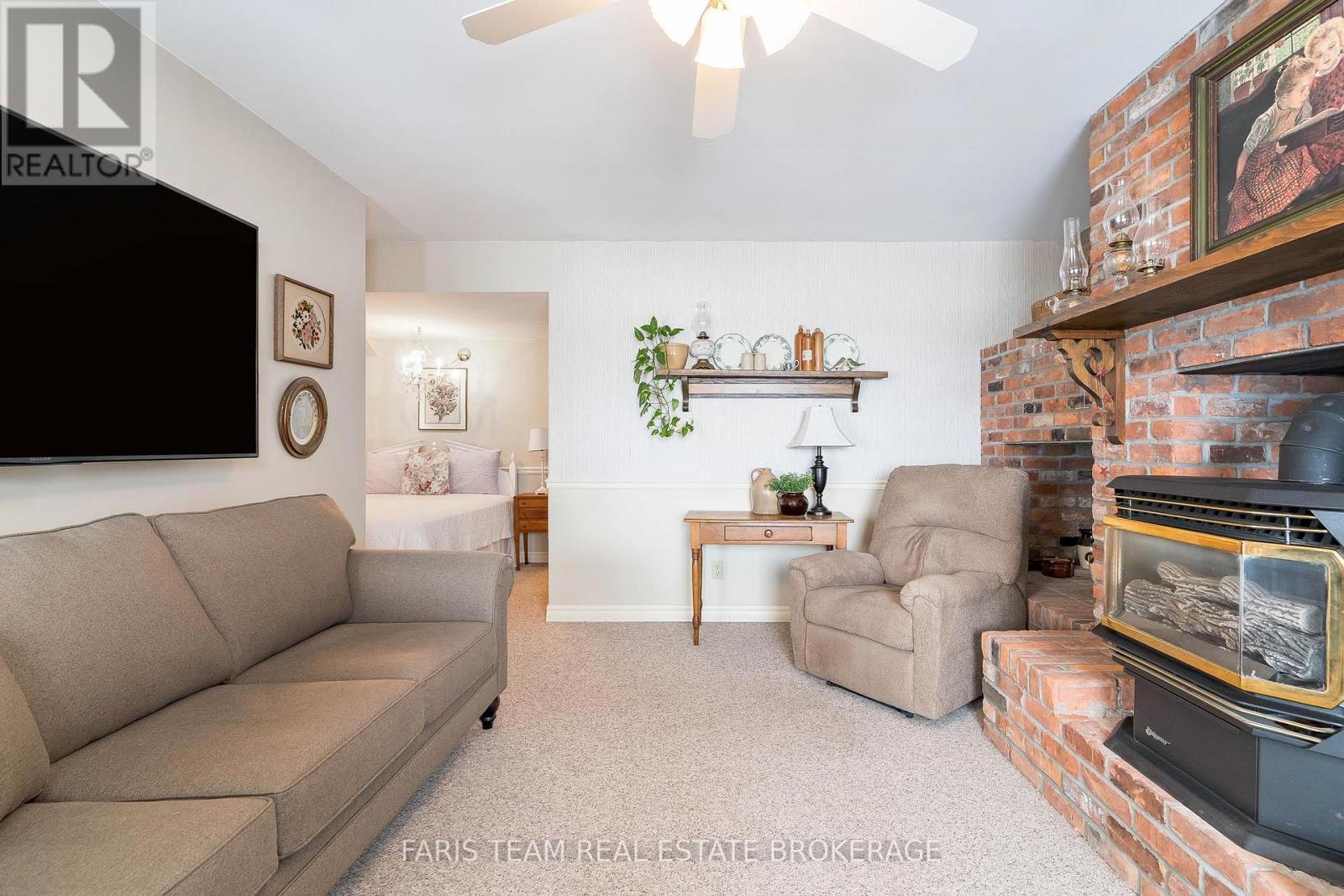 238 Robins Point Road, Tay, ON - Indoor Photo Showing Living Room With Fireplace