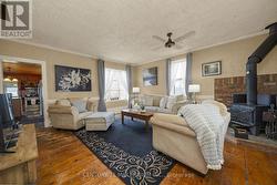 Living room with high ceilings and wood stove -
