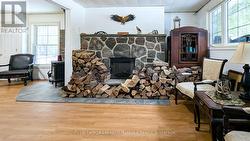 Electric Insert in Stone Fireplace -