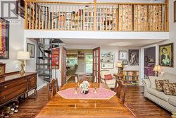 Dining/Living Room with galley & spiral stair case -