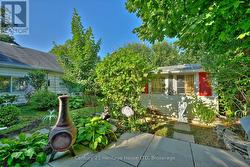 Private backyard garden with bird bath & fountain -