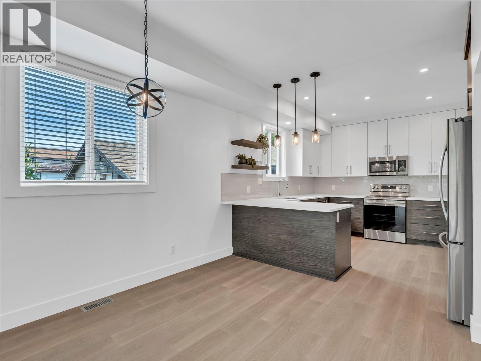 DINING ROOM AND KITCHEN AS IS - 453 Maurice Street Unit# 102, Penticton, BC - Indoor Photo Showing Kitchen With Upgraded Kitchen