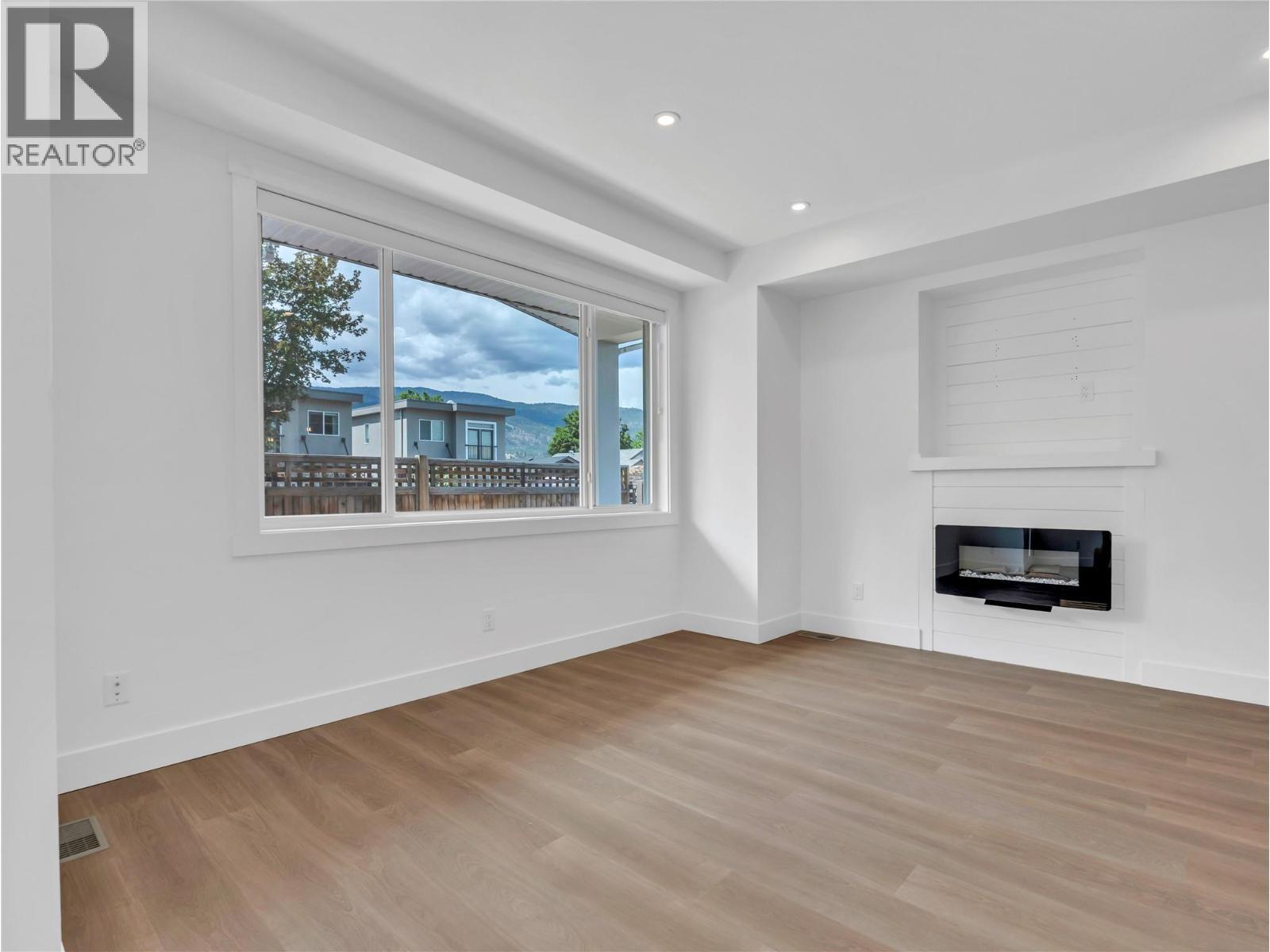 453 Maurice Street Unit# 102, Penticton, BC - Indoor Photo Showing Other Room With Fireplace